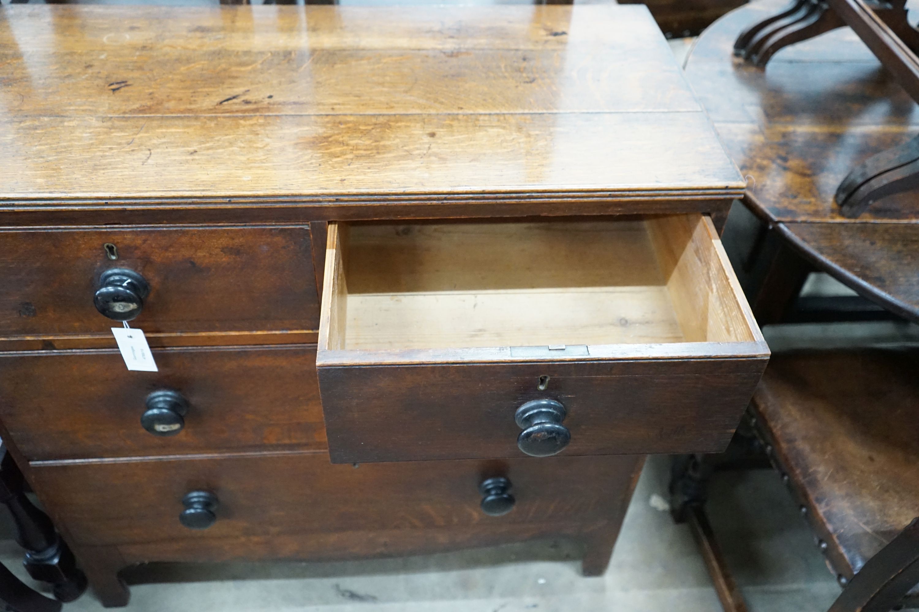 A small Regency provincial oak chest of two short and two long drawers, width 90cm, depth 44cm, height 89cm